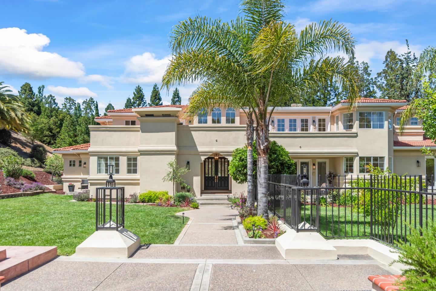 Saratoga estate front entrance with well-maintained lawn and landscaping