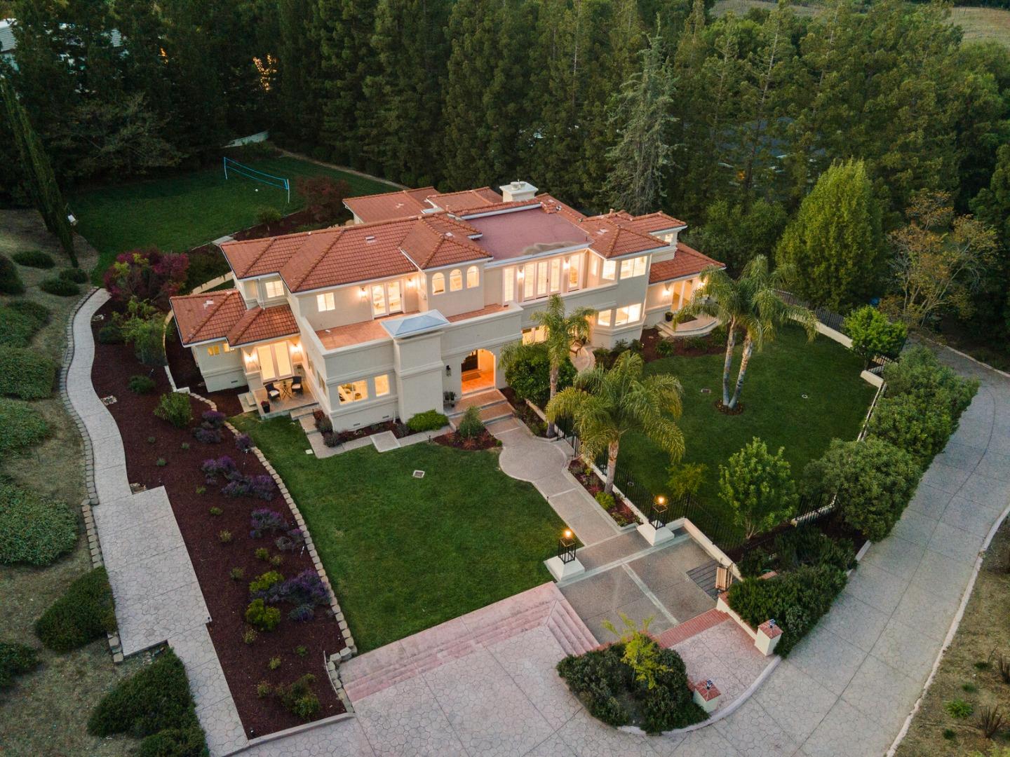Saratoga estate aerial view with manicured grounds at dusk